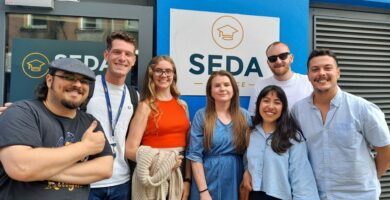 Group of people standing in front of SEDA College Cork